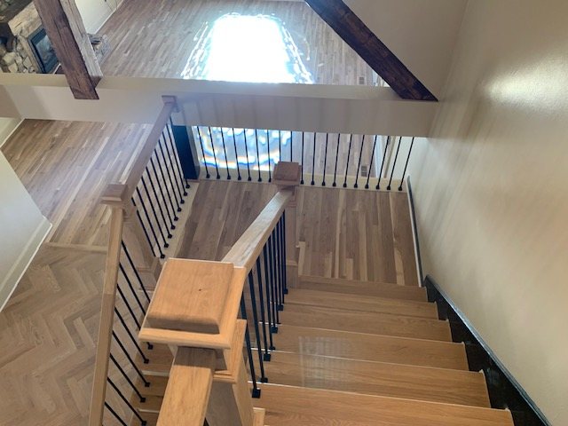 Looking down oak stair treads from the landing